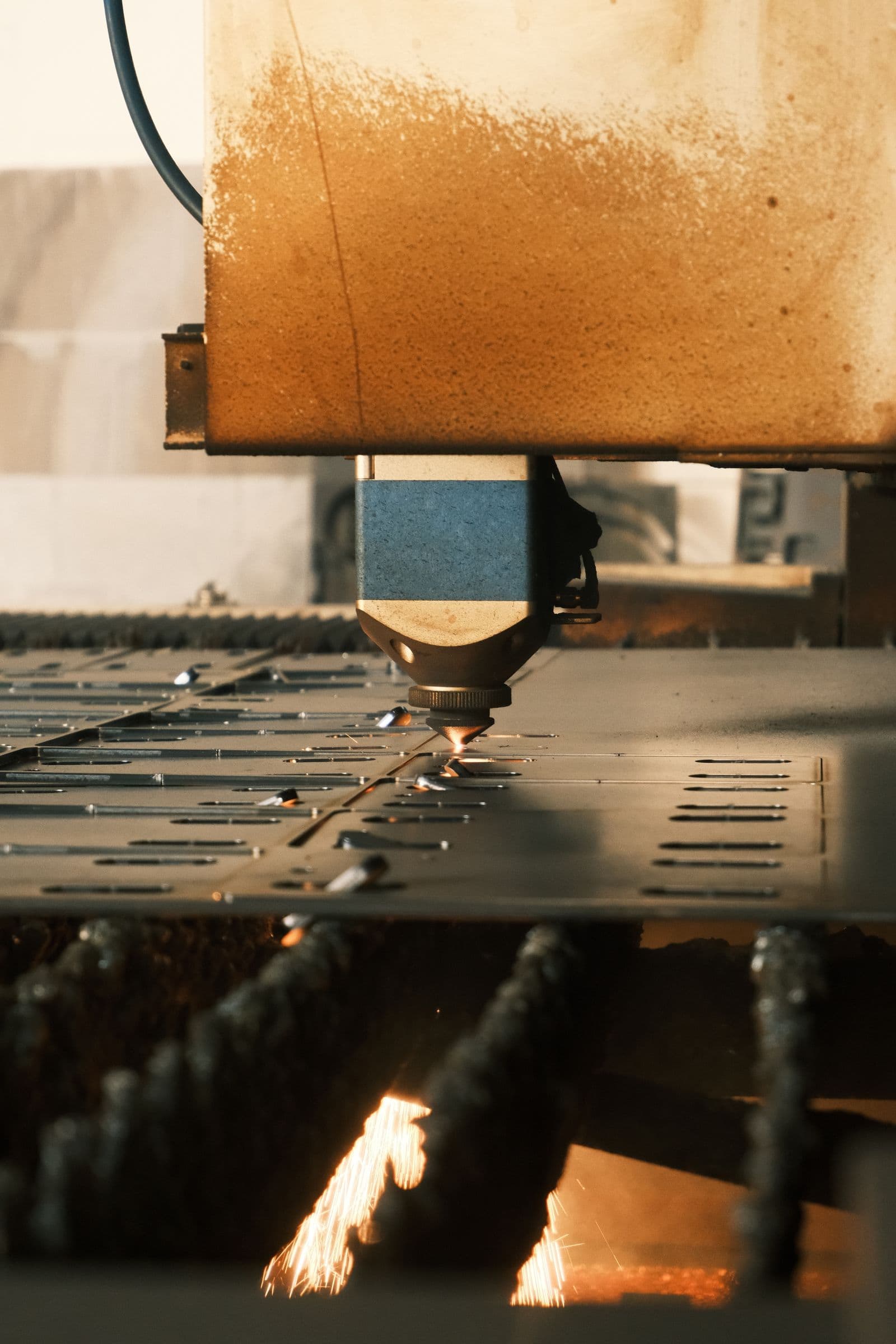 Fiber laser cutting steel sheet with sparks — precision sheet metal fabrication